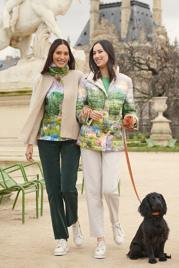 Paris photoshoot of mother and daughter walking a dog through The Tuileries