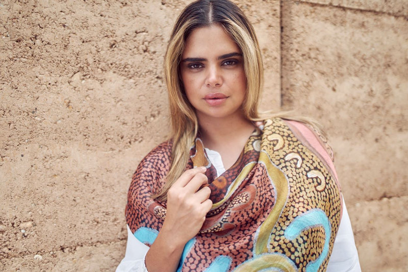 Photograph of model Samantha Harris wearing the Blue Illusion Shani Kellet Scarf over a white shirt